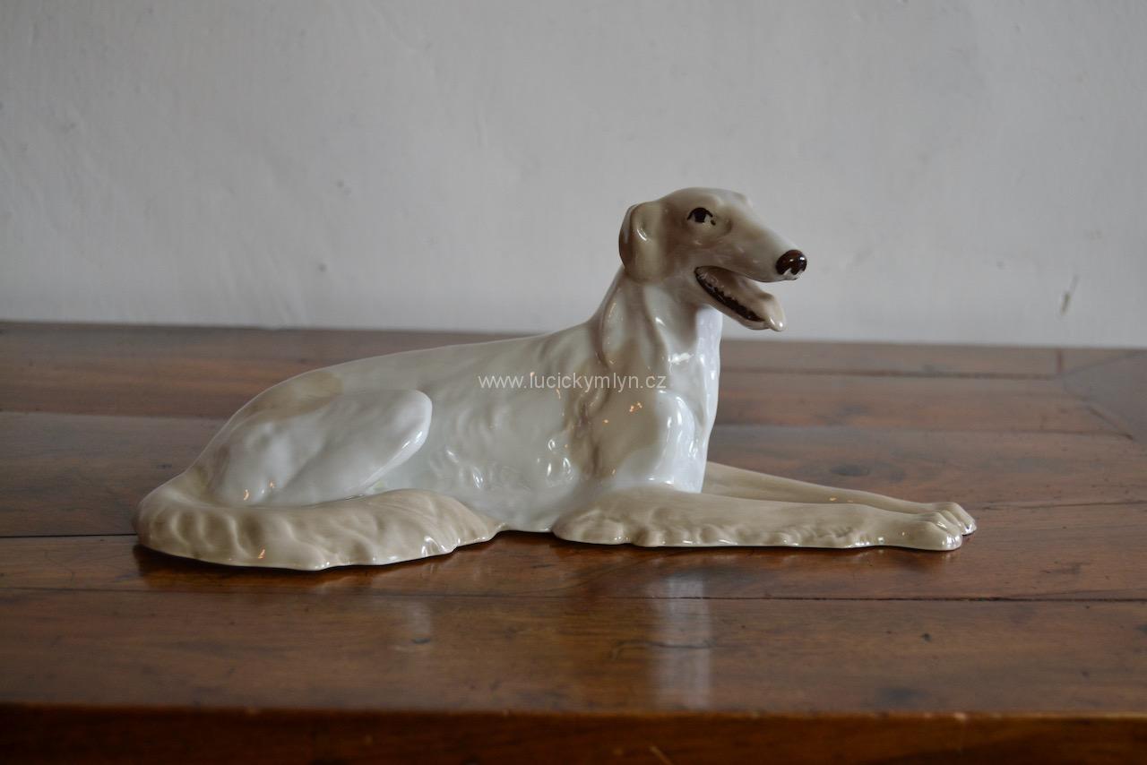 Starožitná porcelánová soška ruského chrta (d.26 cm) Starožitná porcelánová soška ruského chrta (d.26 cm)