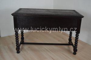 Psací černě mořený a vyřezaný stůl v neorenesančním stylu ze závěru 19. stol.