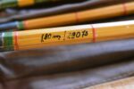 Starožitný čtyř-dílný bambusový rybářský prut DAM Junior v původním textilním obalu