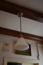 Starožitný lustr ART-DECO z chromované mosazi s kónickým opálovým stínidlem.