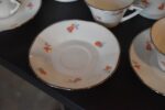 Starožitný porcelánový kávový servis ART-DECO pro 10 osob s květinovým dekorem a zlatou linkou.