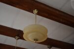 Starožitný rondokubistický lustr ART-DECO s medovým skleněným stínidlem ve tvaru UFO.