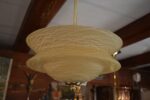 Starožitný rondokubistický lustr ART-DECO s medovým skleněným stínidlem ve tvaru UFO.
